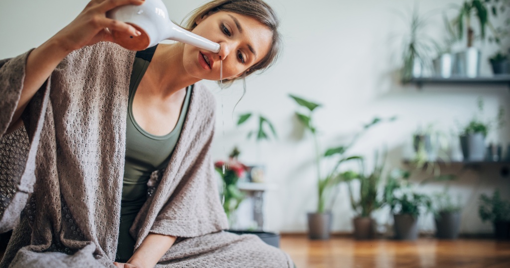 woman using a neti pot