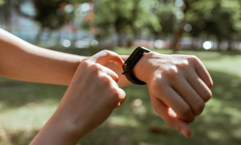 woman checking inaccurate fitness tracker