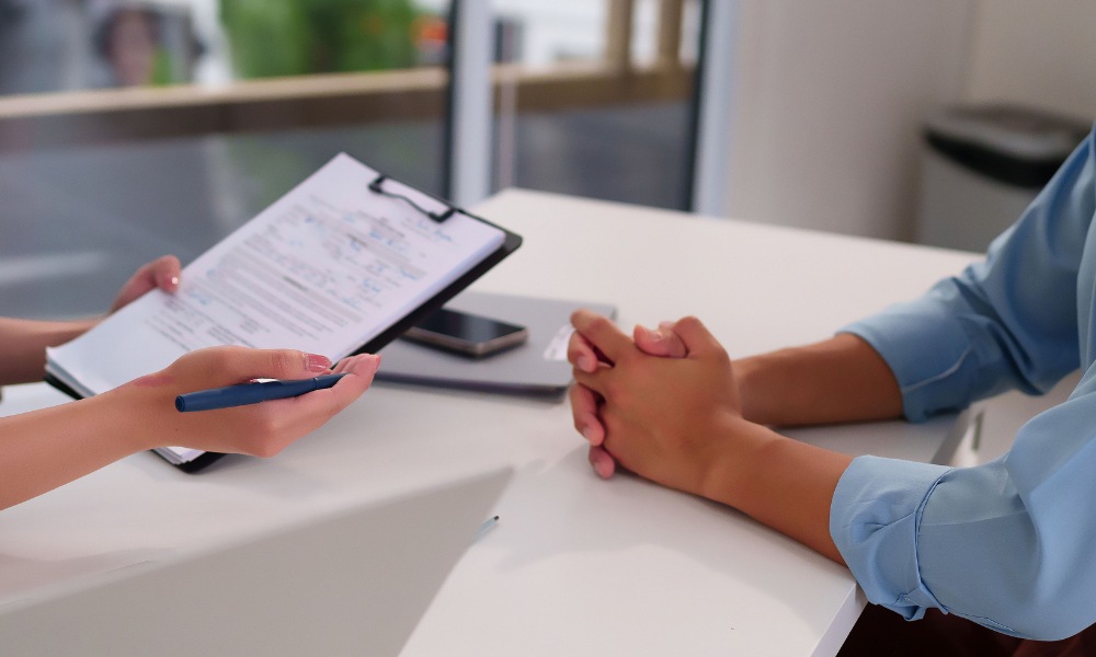 Doctor discussing lab report with patient