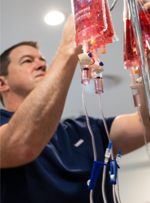 IV Therapy - Male healthcare assistant attending treatment drip 1