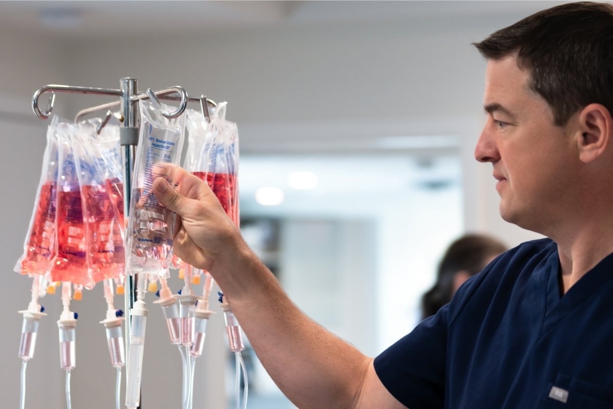 IV Therapy - Male healthcare assistant attending treatment drip 2