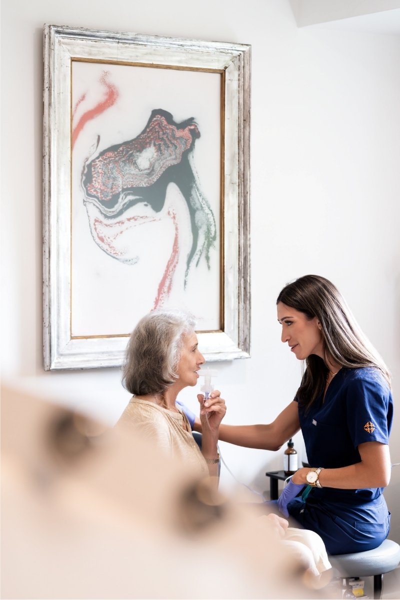 Female doctor talking to female patient