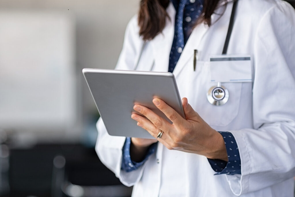 Doctor reviewing lab results on a tablet (1)