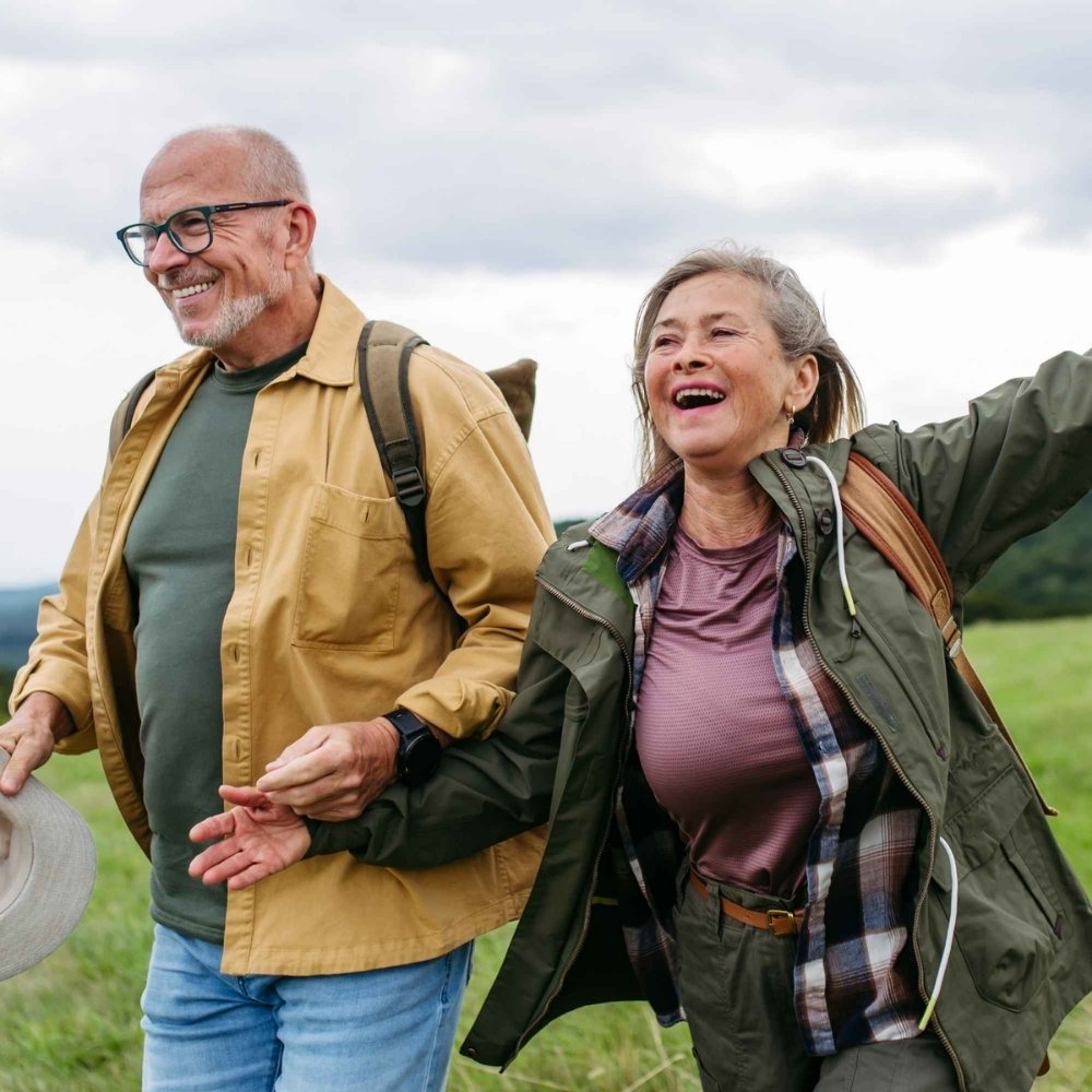 Elderly man and woman having fun on a walk